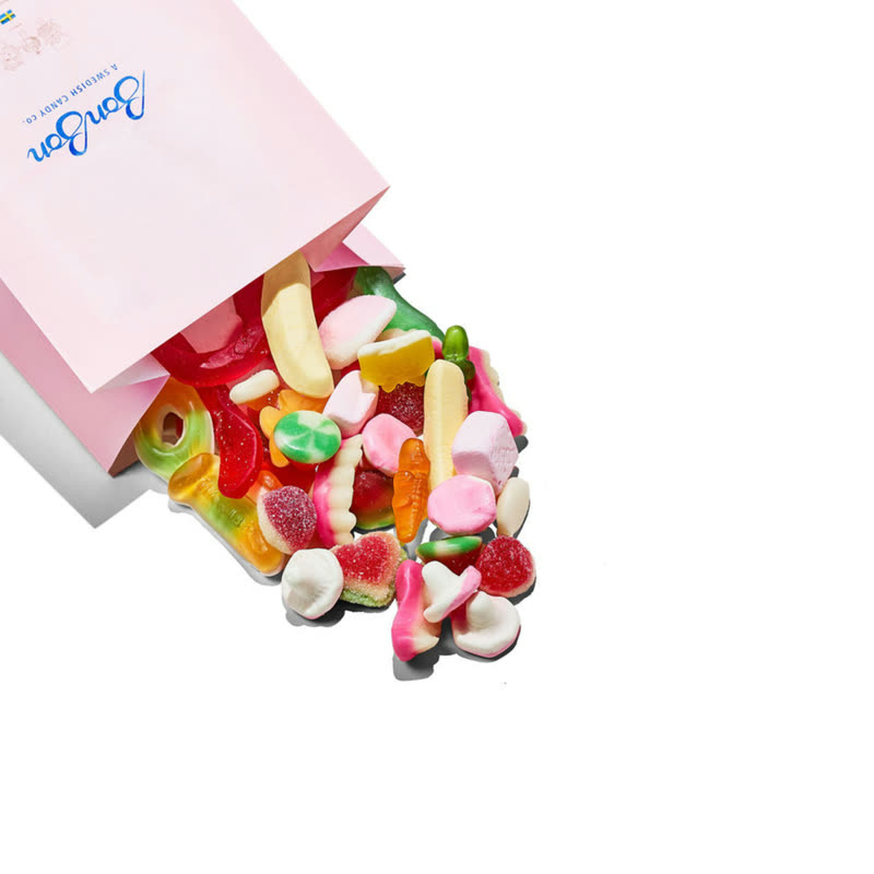 A pink BonBon candy bag spilling Jelly / Marshmallow Mix